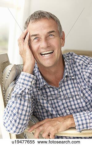 Stock Photography - Mid age man at home. Fotosearch