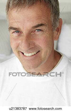 Stock Photo - Mid age man head and shoulders. Fotosearch