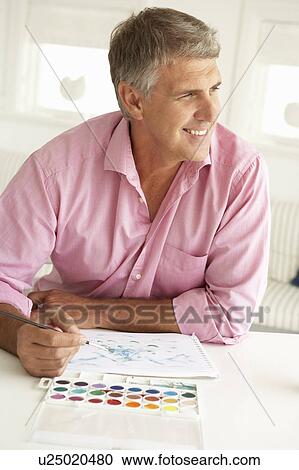 Mid age man painting with watercolors View Large Photo Image Stock Image - Mid age man painting with watercolors. Fotosearch
