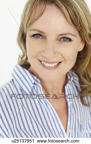 Stock Image - Mid age woman head and shoulders. Fotosearch