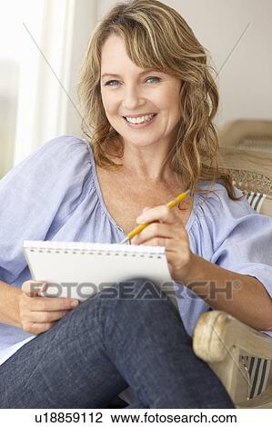 Mid age woman sketching View Large Photo Image Stock Image - Mid age woman sketching. Fotosearch