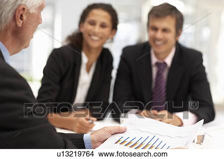 Mixed group in business meeting View Large Photo Image Picture - Mixed group in business meeting. Fotosearch