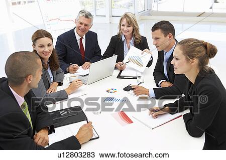 Mixed group in business meeting View Large Photo Image Stock Image - Mixed group in business meeting. Fotosearch