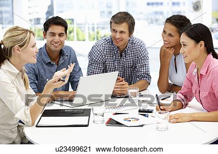 Mixed group in business meeting View Large Photo Image Stock Image - Mixed group in business meeting. Fotosearch