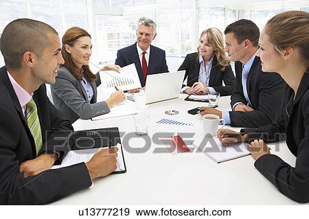 Mixed group in business meeting View Large Photo Image Stock Photo - Mixed group in business meeting. Fotosearch