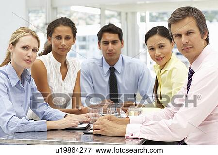 Mixed group in business meeting View Large Photo Image Stock Photo - Mixed group in business meeting. Fotosearch