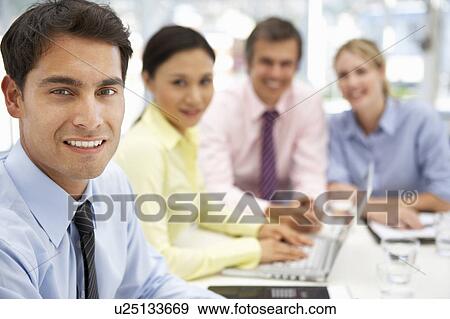 Mixed group in business meeting View Large Photo Image Stock Photo - Mixed group in business meeting. Fotosearch