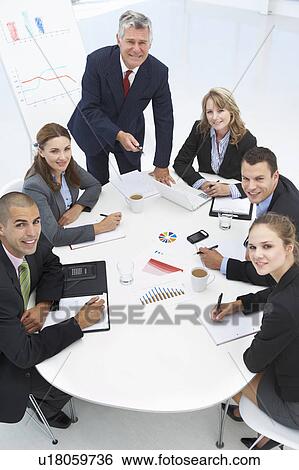 Mixed group in business meeting View Large Photo Image Stock Photograph - Mixed group in business meeting. Fotosearch