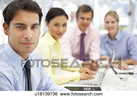 Mixed group in business meeting View Large Photo Image Stock Photograph - Mixed group in business meeting. Fotosearch
