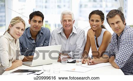 Mixed group in business meeting View Large Photo Image Stock Photograph - Mixed group in business meeting. Fotosearch