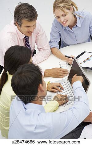Mixed group in business meeting View Large Photo Image Stock Photograph - Mixed group in business meeting. Fotosearch