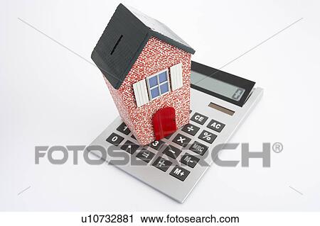 Model house and calculator View Large Photo Image Stock Image - Model house and calculator. Fotosearch