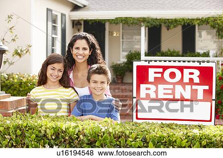Mother and children outside home for rent View Large Photo Image Stock Photo - Mother and children outside home for rent. Fotosearch