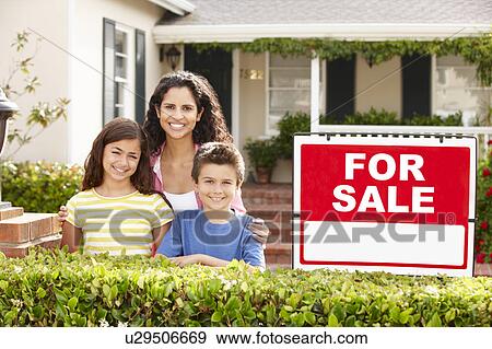 Stock Photo - Mother and children outside home for rent. Fotosearch
