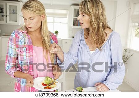 Mother and teenage daughter arguing about housework View Large Photo Image Stock Photograph - Mother and teenage daughter arguing about housework. Fotosearch