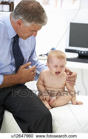 Pediatrician with baby View Large Photo Image Stock Image - Pediatrician with baby. Fotosearch