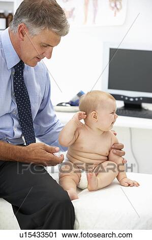Pediatrician with baby View Large Photo Image Stock Image - Pediatrician with baby. Fotosearch