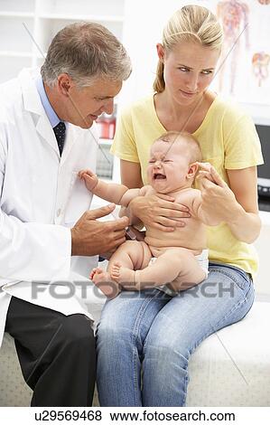 Pediatrician with baby View Large Photo Image Stock Photo - Pediatrician with baby. Fotosearch
