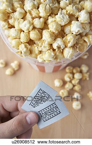 Popcorn and cinema tickets View Large Photo Image Stock Image - Popcorn and cinema tickets. Fotosearch