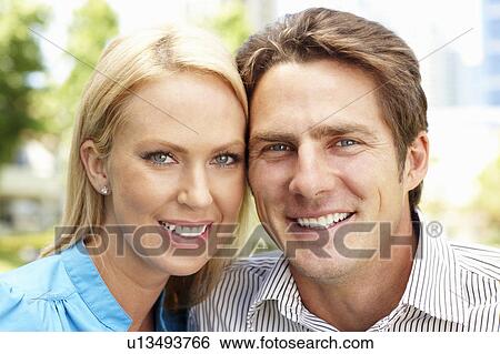 Stock Photograph - Portrait couple outdoors. Fotosearch