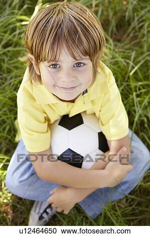 Stock Image - Portrait of happy boy. Fotosearch