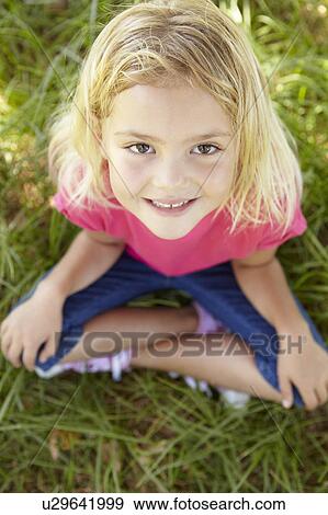 Stock Photo - Portrait of happy girl. Fotosearch