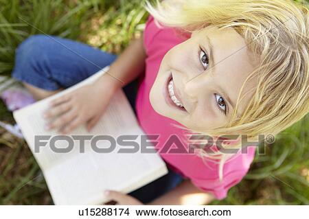 Portrait of happy girl with book View Large Photo Image Picture - Portrait of happy girl with book. Fotosearch