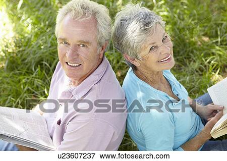 Stock Photo - Portrait of senior couple reading. Fotosearch