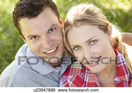 Stock Photograph - Portrait of young couple. Fotosearch