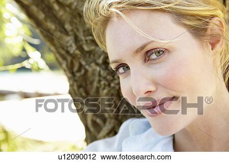 Stock Image - Portrait of young woman. Fotosearch