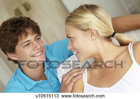 Stock Image - Portrait teenage girl and boy at home. Fotosearch