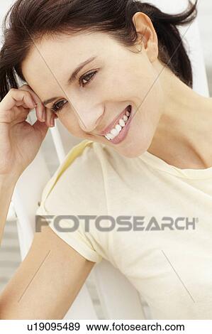 Stock Photo - Portrait woman outdoors. Fotosearch