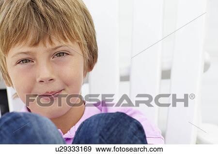 Stock Photo - Portrait young boy outdoors. Fotosearch