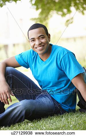 Stock Photo - Portrait young man outdoors. Fotosearch