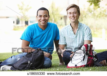 Stock Image - Portrait young men outdoors. Fotosearch