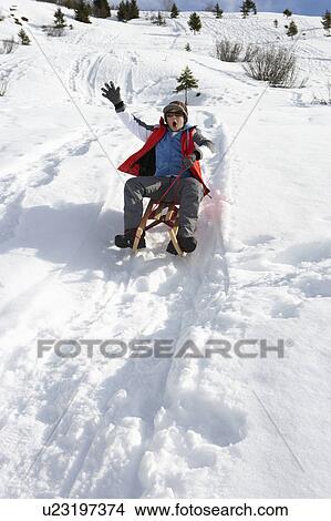 Pre-teen Boy On A Sled In The Snow View Large Photo Image Picture - Pre-teen Boy On A Sled In The Snow. Fotosearch