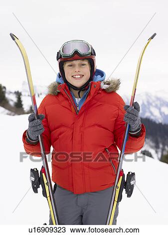 Stock Image - Pre-teen Boy On Ski Vacation. Fotosearch