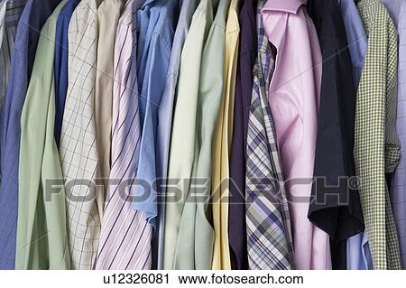 Stock Image - Rail of men's shirts. Fotosearch