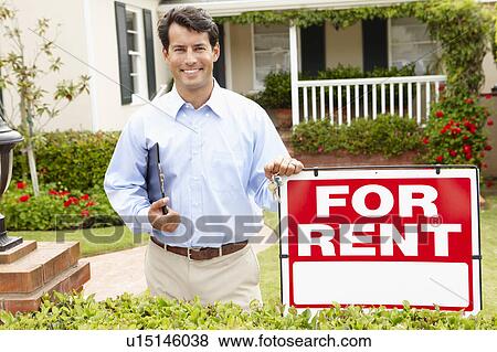 Real estate agent at work View Large Photo Image Stock Photo - Real estate agent at work. Fotosearch