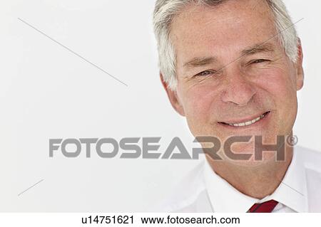 Stock Image - Senior businessman head and shoulders. Fotosearch