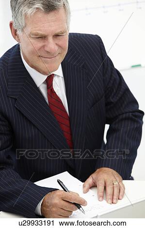 Senior businessman in meeting View Large Photo Image Stock Image - Senior businessman in meeting. Fotosearch