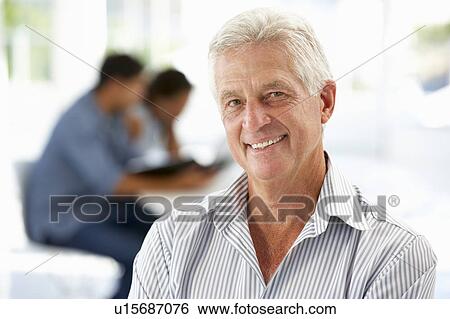 Stock Photograph - Senior businessman in office. Fotosearch