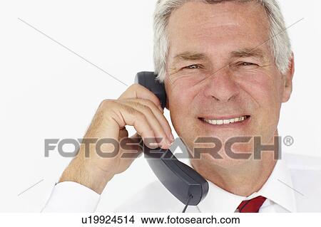Picture - Senior businessman on phone. Fotosearch