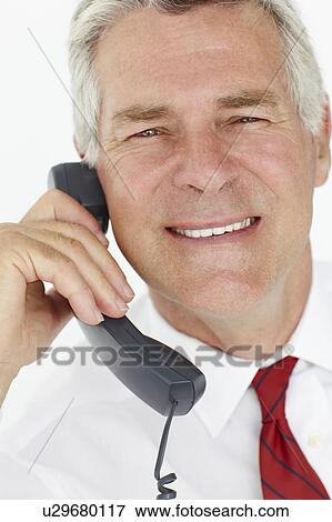 Stock Photo - Senior businessman on phone. Fotosearch