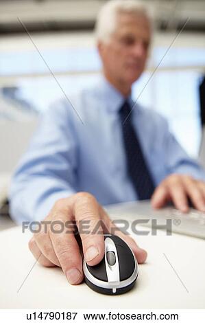 Stock Photo - Senior businessman using laptop. Fotosearch
