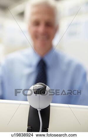 Senior businessman using skype View Large Photo Image Picture - Senior businessman using skype. Fotosearch