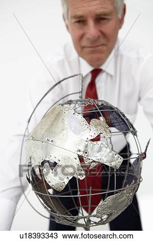 Senior businessman with globe View Large Photo Image Stock Image - Senior businessman with globe. Fotosearch