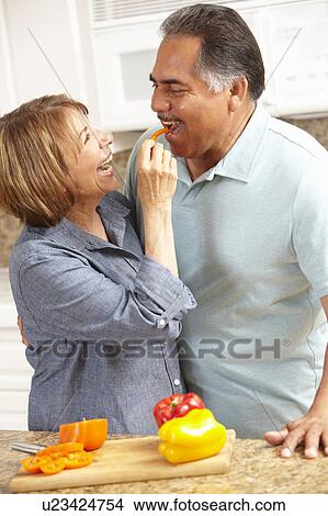 Picture - Senior couple cooking. Fotosearch
