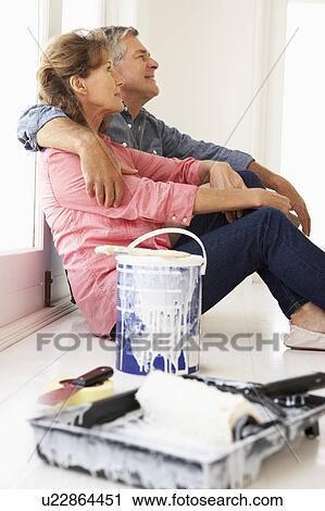 Senior couple decorating house View Large Photo Image Stock Image - Senior couple decorating house. Fotosearch
