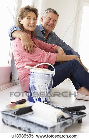 Senior couple decorating house View Large Photo Image Stock Photography - Senior couple decorating house. Fotosearch